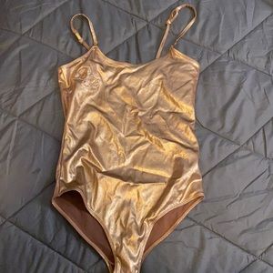 Baby Phat gold body suit/romper